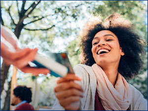 woman using tap to pay with card