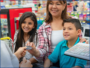 woman with two children at a store