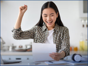 person excited looking at paper