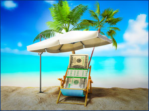 cash sitting in chair on a beach
