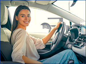 person sitting car on driver side