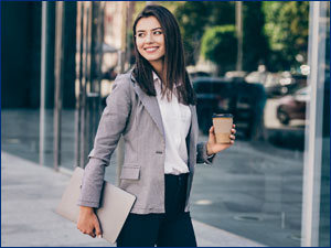woman walking towards office building