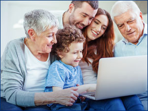 Family looking at laptop computer