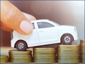 Toy car on top of a stack of coins