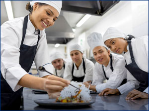 Culinary students in a kitchen.
