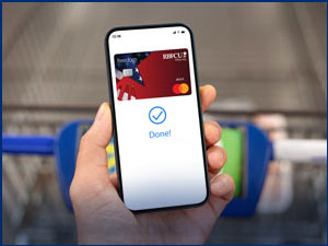 Smartphone with RBFCU Freedom Debit Card on screen