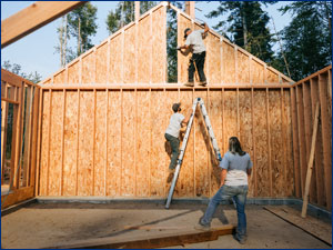 Construction workers framing a home
