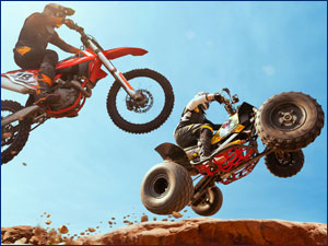 People riding a motorcycle and ATV
