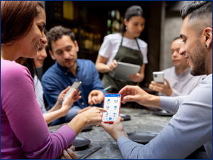 people gathered looking at move money screen on RBFCU mobile app