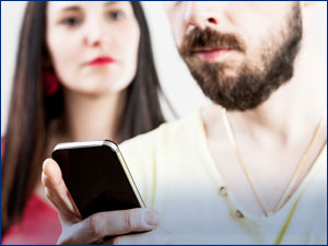 People looking at a cellphone.