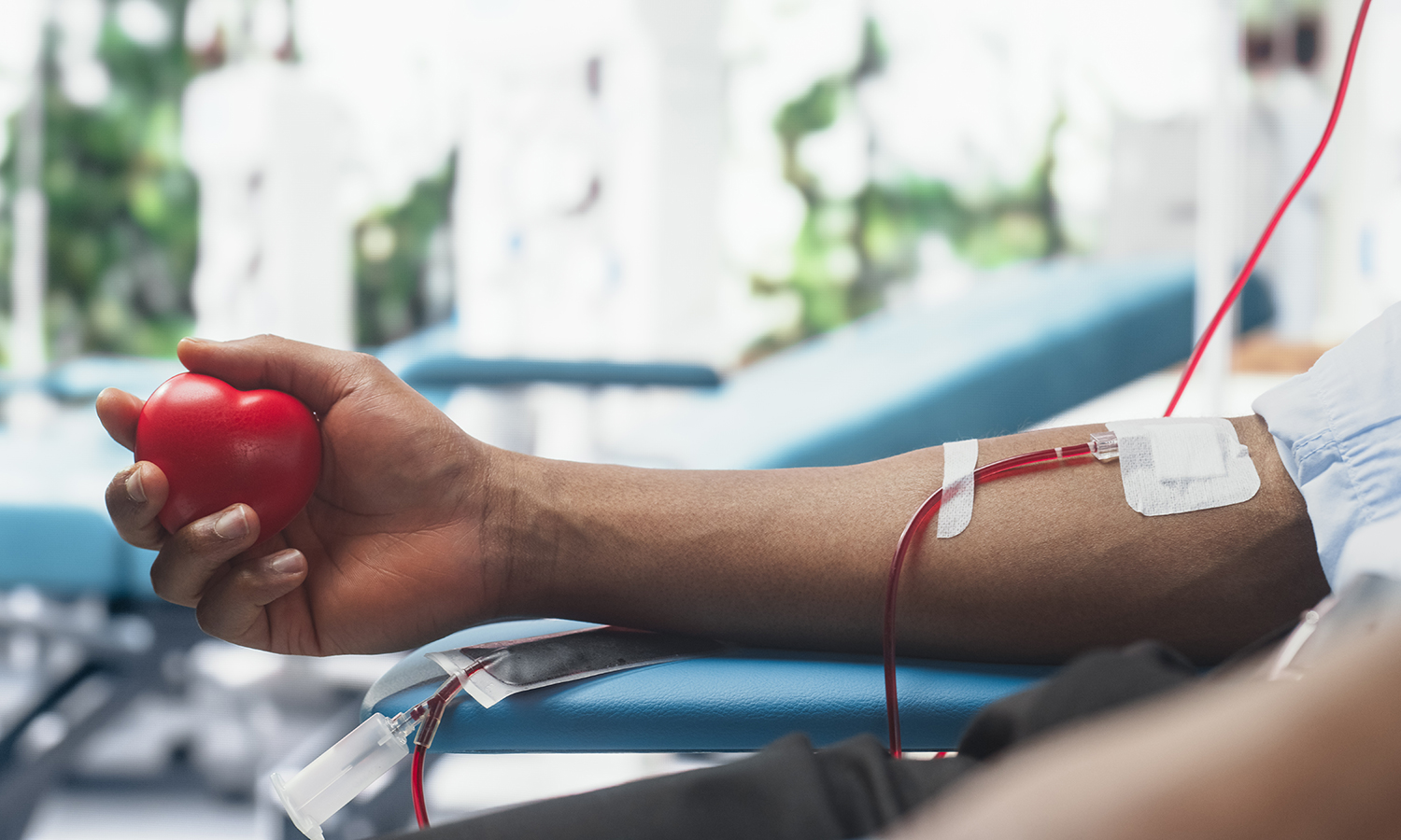 Man giving blood at a blood drive