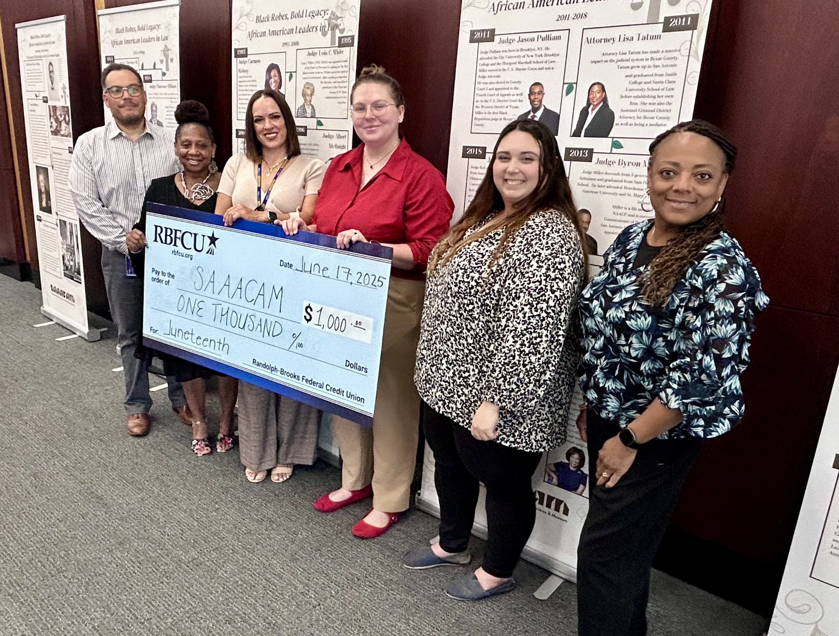 RBFCU and SAAACAM leaders with donation check.