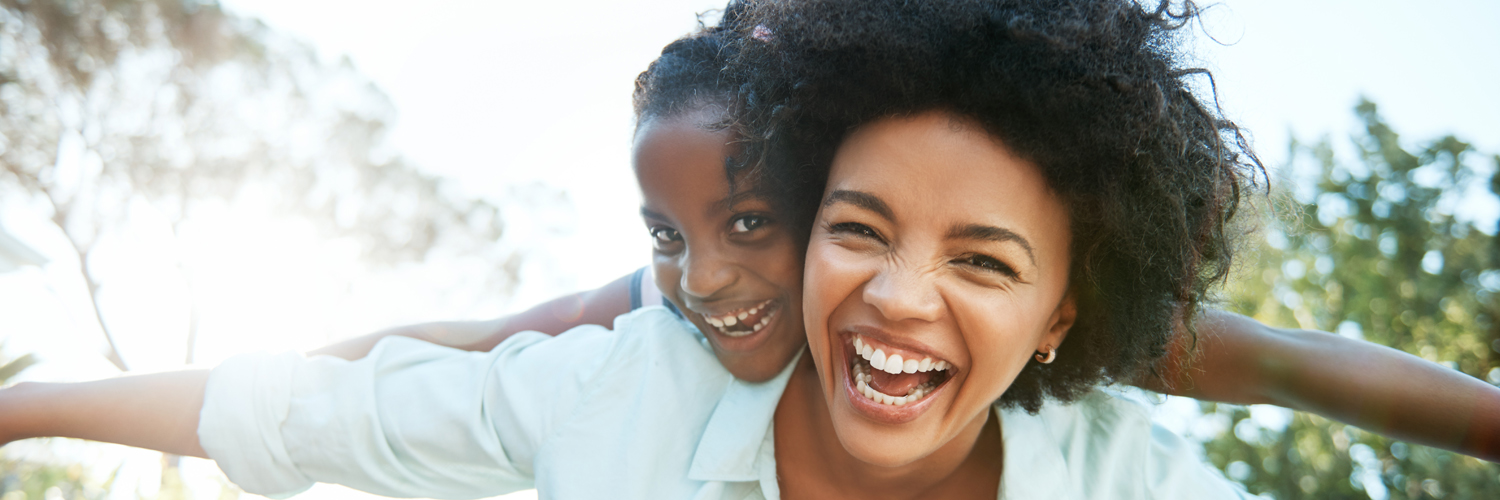 banking-overview-hero Woman playing with daughter and smiling