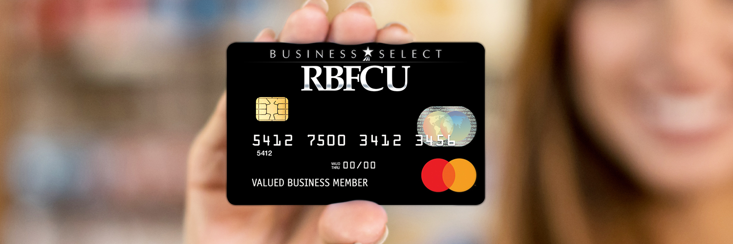 Business Credit Card Person holding up RBFCU's Business Select Mastercard