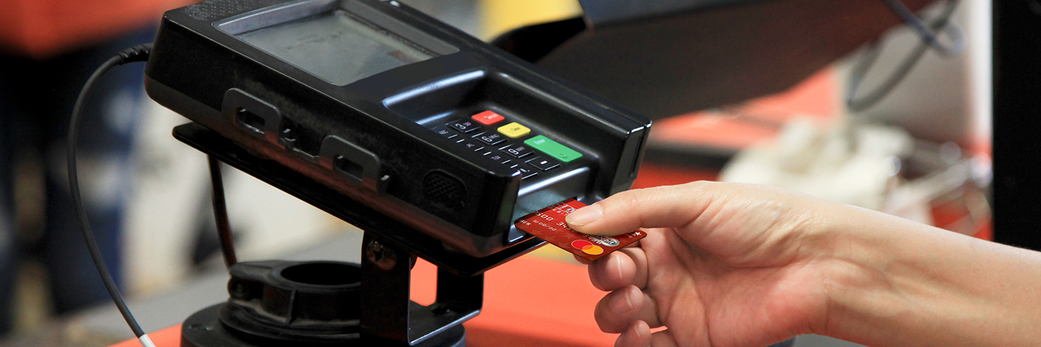 Business Services Person completing a credit card transaction