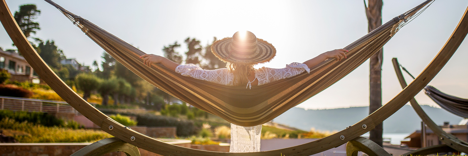 Current Cardholder Promotions Woman laying in hammock