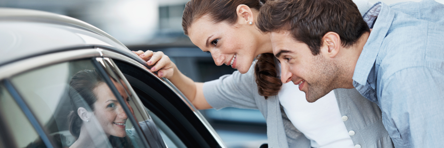 Find Your Next Car Two people looking at car for sale