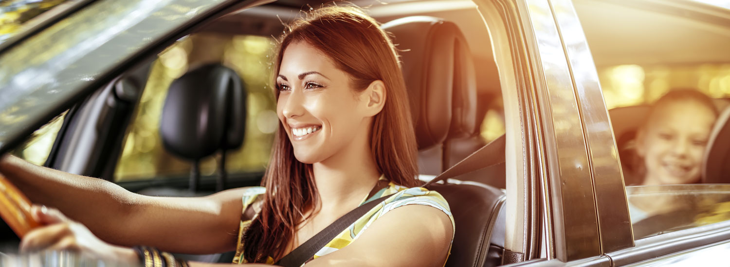 INS-AGNCY-Half-Hero-Auto-Insurance-FIN Woman driving car with daughter in back seat
