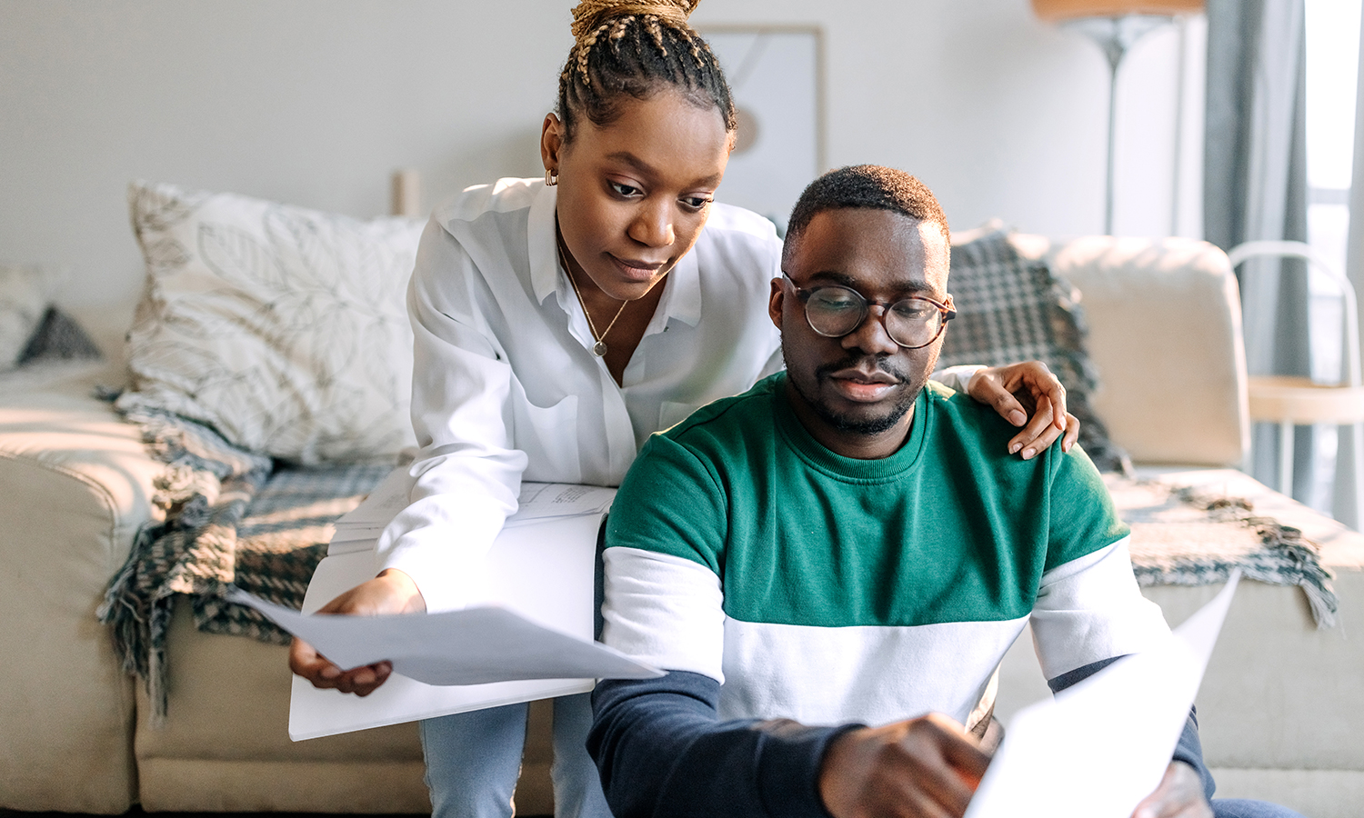 Woman and man reviewing bills and finances