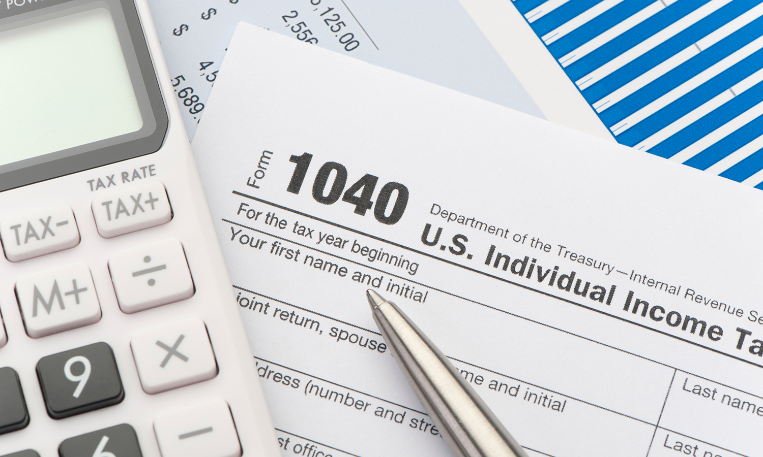 1040 Tax Form, calculator and pen