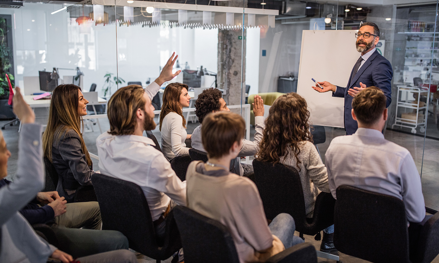 Presenter leads a business meeting