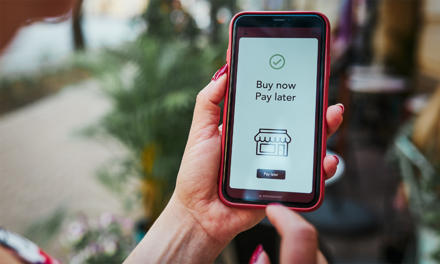 Woman reviewing Buy Now, Pay Later option on smartphone