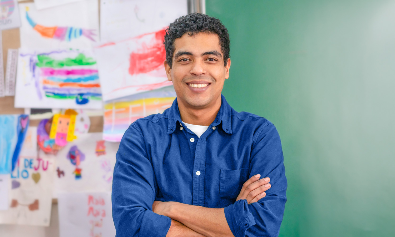 Man smiling with folded arms