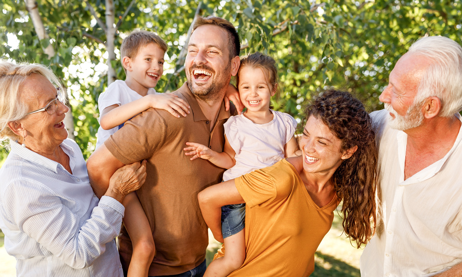 family gathering outside around trees