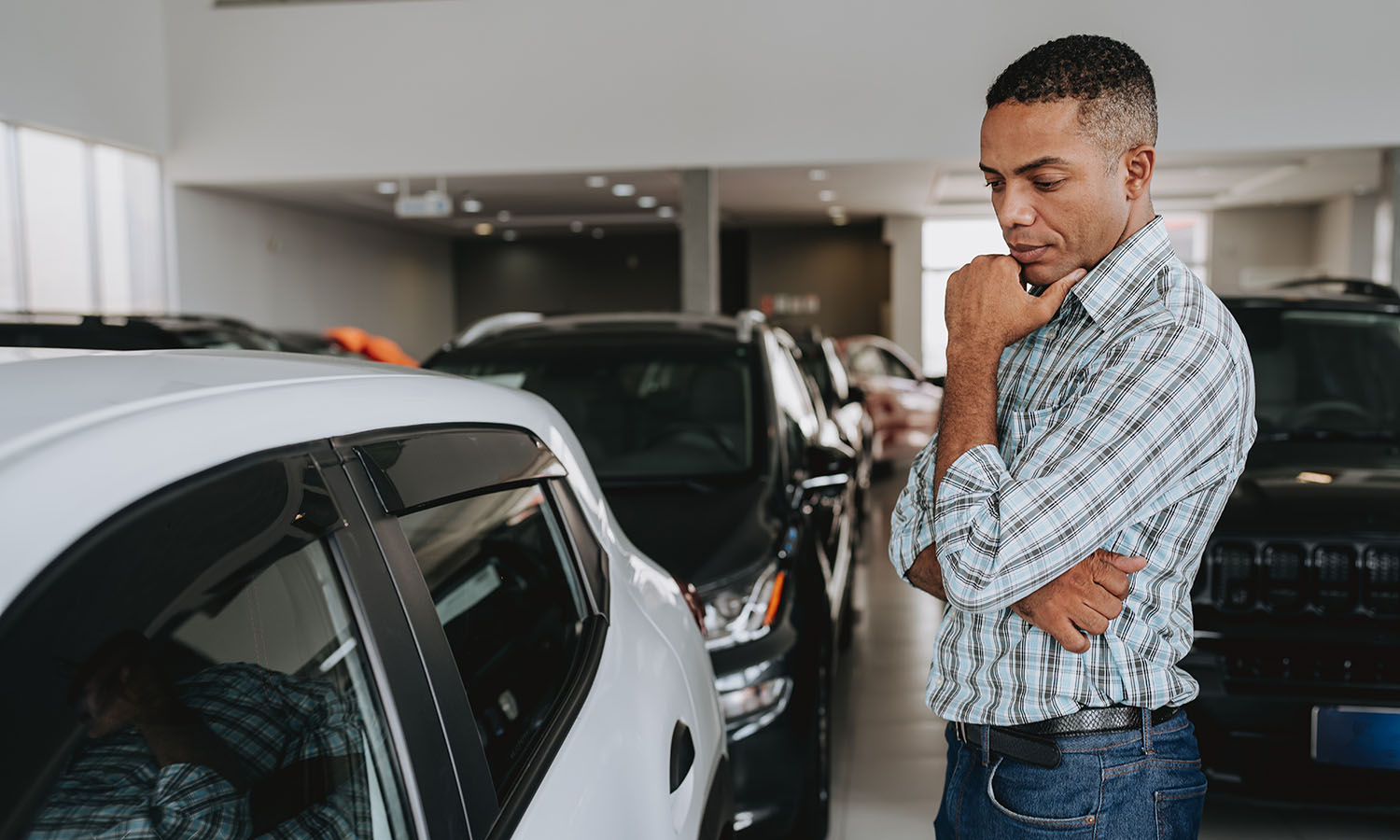 Man analyzing car to buy