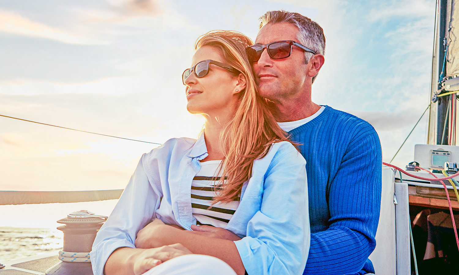 Couple holding each other while on a boat