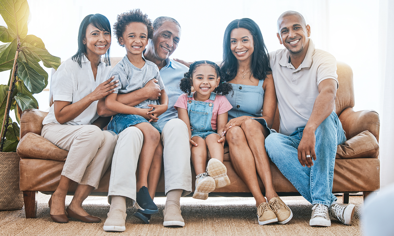 Multi-generational family posing on couch