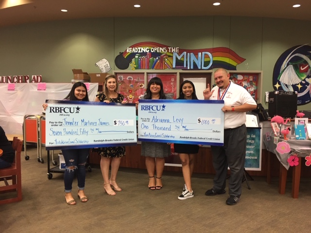 2019 YAC Scholarships RBFCU Financial Literacy Specialists Jennifer Crawford and Michelle Herrera (second and third from left) present Youth Advisory Council members Jennifer Martinez Jaimes and Adrianna Levy, both seniors at Judson High School, with scholarships on Friday, May 17, 2019.
