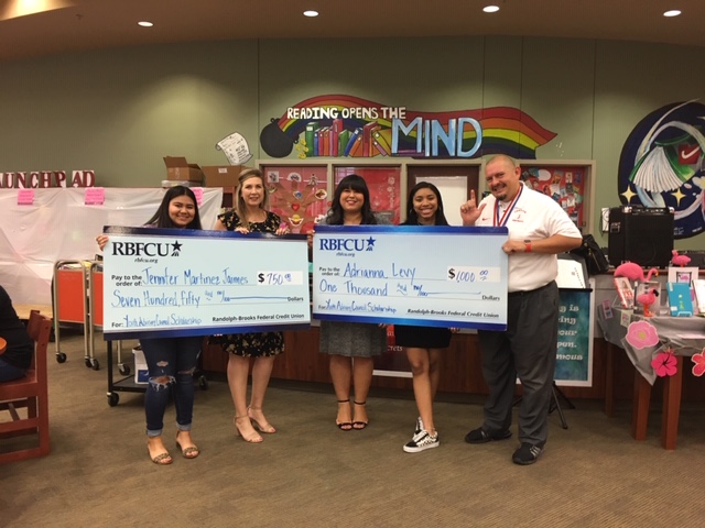 RBFCU Financial Literacy Specialists Jennifer Crawford and Michelle Herrera (second and third from left) present Youth Advisory Council members Jennifer Martinez Jaimes and Adrianna Levy, both seniors at Judson High School, with scholarships on Friday, May 17, 2019.