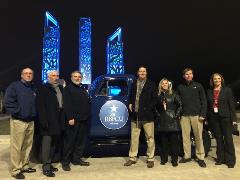 Officials from RBFCU pose with a 1952-model pickup at the celebration for the completion of IKEA-RBFCU Parkway.