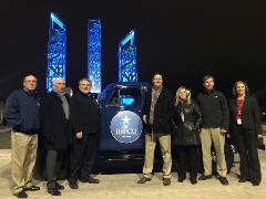 Officials from RBFCU pose with a 1952-model pickup at the celebration for the completion of IKEA-RBFCU Parkway.