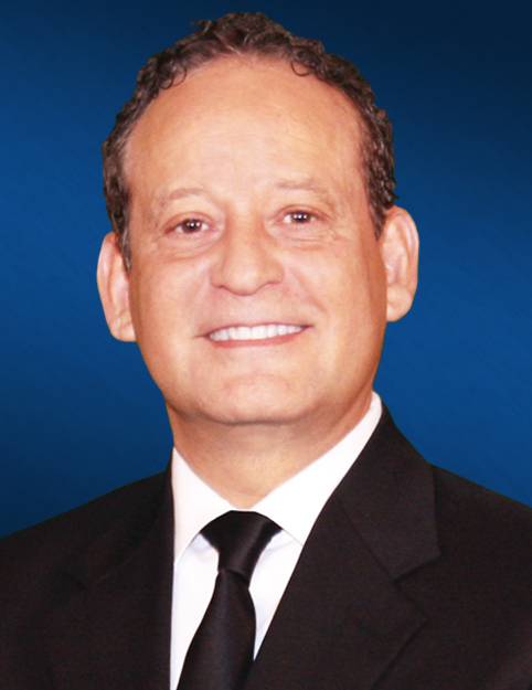 an image ofJohn Rodriguez wearing a black suite and black tie