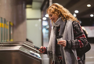Woman paying for a bus pass.